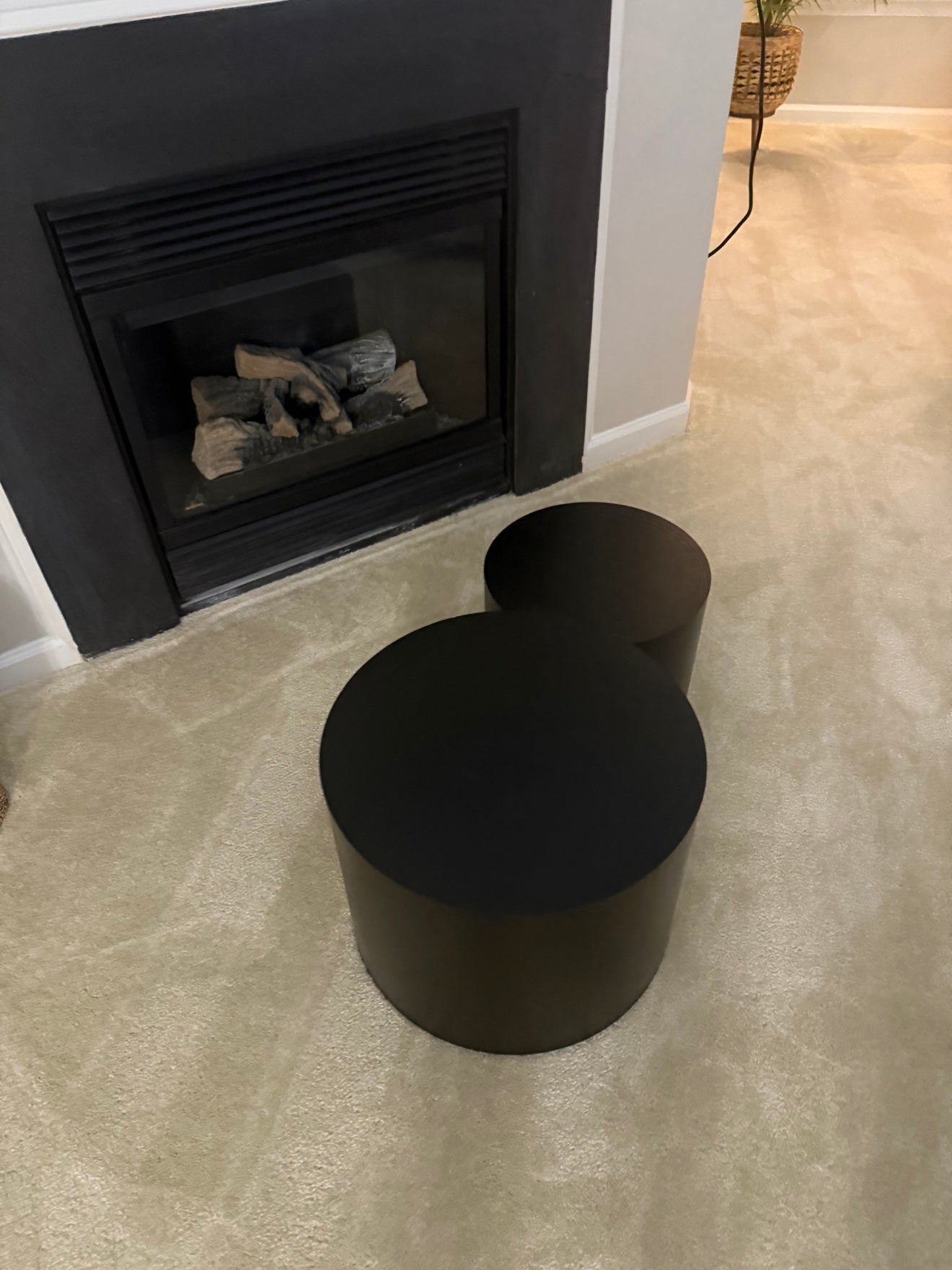 Black sculptural nesting tables in Erica's living room
